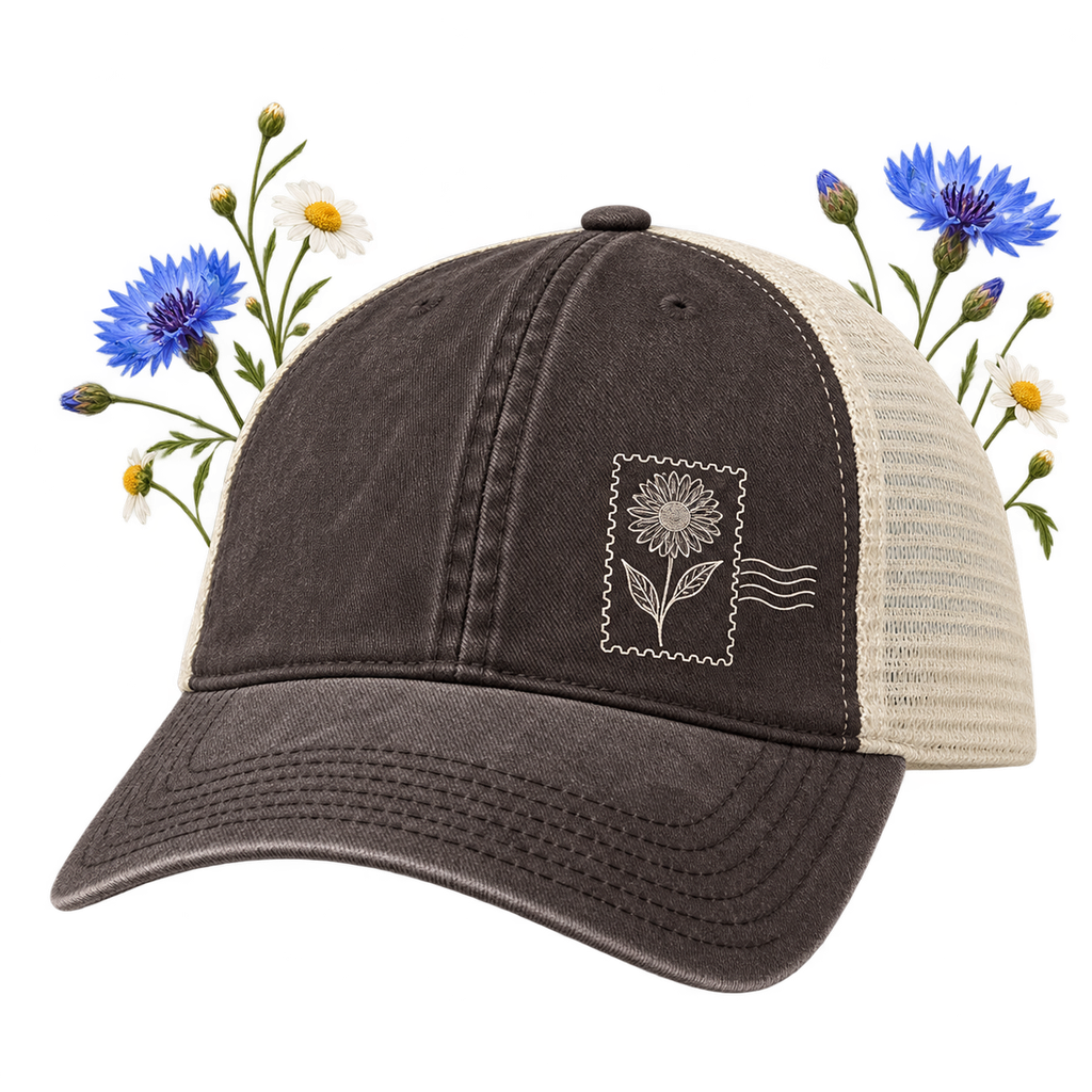 The Game GB460 Pigment-Dyed Trucker Cap — unstructured, low-profile six-panel design with a pre-curved brim